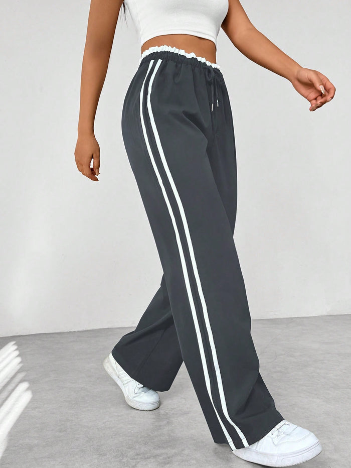 Katia | Loose-fit high-waisted track pants with side stripes