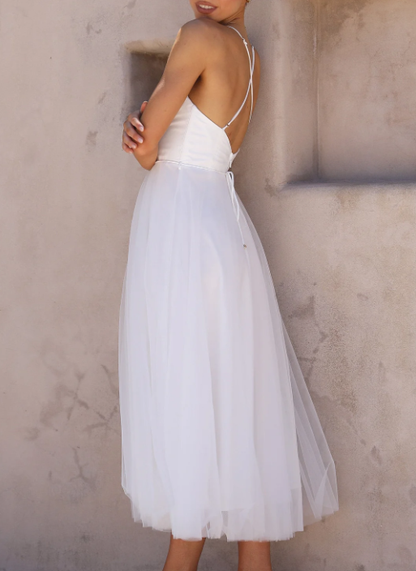 Aitana | Fitted midi dress with thin straps and a flowing skirt