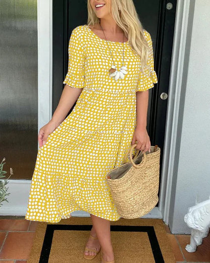 Estrella | Robe midi décontractée à pois avec manches courtes