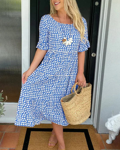 Estrella | Robe midi décontractée à pois avec manches courtes