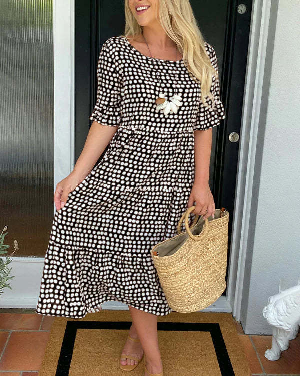 Estrella | Robe midi décontractée à pois avec manches courtes
