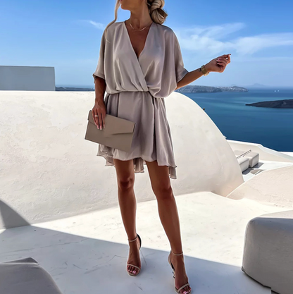 Jana | Elegant women's short dress with a wrap design and fluid drape