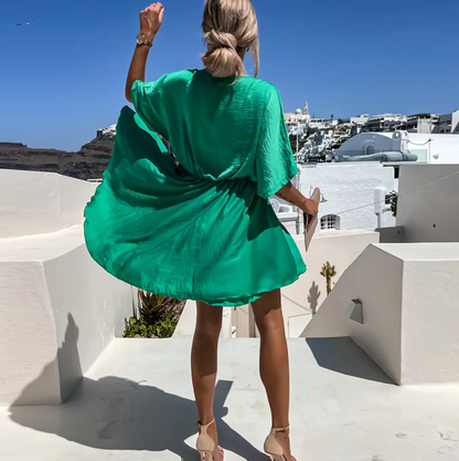 Jana | Elegant women's short dress with a wrap design and fluid drape