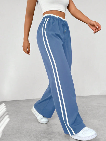 Katia | Loose-fit high-waisted track pants with side stripes