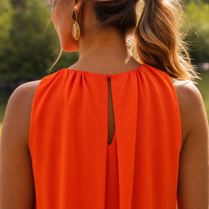 Paloma | Sleeveless midi dress with high neck and flowing design