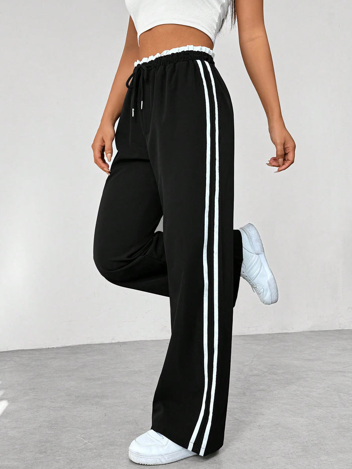 Katia | Loose-fit high-waisted track pants with side stripes